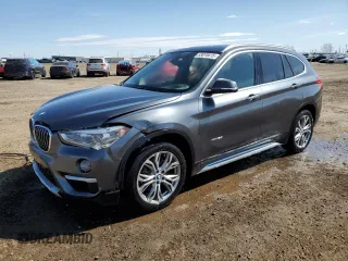 2017 BMW X1 xDrive28i with VIN WBXHT3C37H5F75301, listed as a Copart auction lot 53070615 with 103,280 mi miles and Salvage title. Bid and sale history available at DreamBid. Image 1.