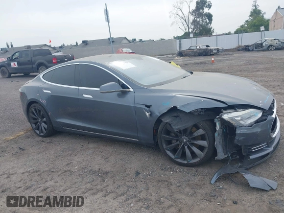 2013 Tesla Model S with VIN 5YJSA1AG5DFP13149, listed as a IAAI auction lot 42116437 with 140,999 mi miles. Bid and sale history available at carsss.com. Image 14.