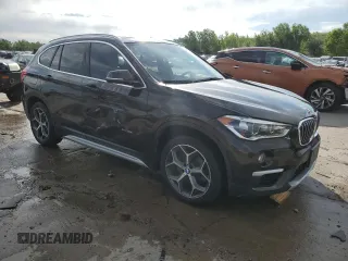 2017 BMW X1 xDrive28i with VIN WBXHT3C32H5F71690, listed as a Copart auction lot 60852375 with 67,475 mi miles and Salvage title. Bid and sale history available at DreamBid. Image 4.