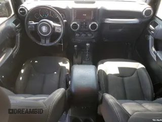 2016 Jeep Wrangler Unlimited Rubicon with VIN 1C4BJWFG5GL290757, listed as a Copart auction lot 52099225 with 102,424 mi miles and Salvage title. Bid and sale history available at DreamBid. Image 8.