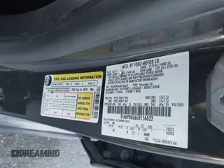 2016 Ford Fusion Titanium Hybrid with VIN 3FA6P0RU6GR156622, listed as a IAAI auction lot 41178887 with 92,423 mi miles. Bid and sale history available at carsss.com. Image 9.