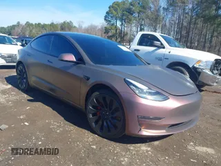 2021 Tesla Model 3 Performance z VIN 5YJ3E1EC5MF849832, wystawiony jako IAAI lot #41526209 z przebiegiem 66 325 mil mil oraz . Historia ofert i sprzedaży dostępna na DreamBid. Obrazek 1.