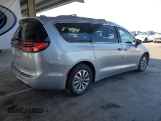 2021 Chrysler Pacifica Hybrid Touring L with VIN 2C4RC1L7XMR593911, listed as a Copart auction lot 57842415 with 74,910 mi miles and Salvage title. Bid and sale history available at DreamBid. Image 3.