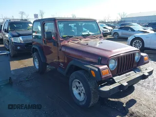 2003 Jeep Wrangler SE with VIN 1J4FA29103P371311, listed as a IAAI auction lot 41556379 with 120,106 mi miles. Bid and sale history available at carsss.com. Image 1.