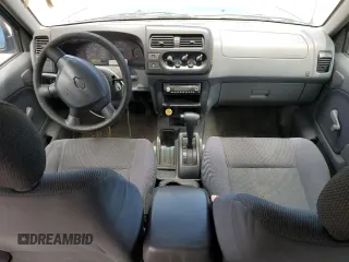 2001 Nissan Frontier SE with VIN 1N6ED27T91C390230, listed as a Copart auction lot 58844905 with 157,883 mi miles and Salvage title. Bid and sale history available at DreamBid. Image 8.