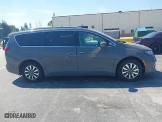 2021 Chrysler Pacifica Hybrid Touring L with VIN 2C4RC1L7XMR586201, listed as a IAAI auction lot 41859340 with 55,906 mi miles. Bid and sale history available at carsss.com. Image 13.