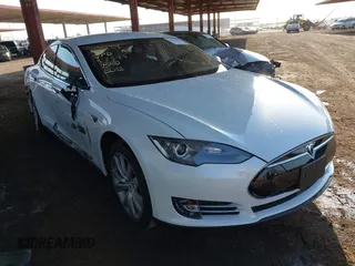 2014 Tesla Model S 60 with VIN 5YJSA1H14EFP63737, listed as a IAAI auction lot 41947610 with 62,240 mi miles and . Bid and sale history available at DreamBid. Image 1.