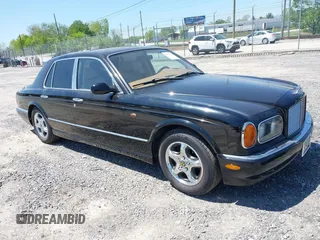 1999 Bentley Arnage z VIN SCBLB51E1XCX01401, wystawiony jako IAAI lot #42133144 z przebiegiem 29 699 mil mil oraz . Historia ofert i sprzedaży dostępna na DreamBid. Obrazek 1.