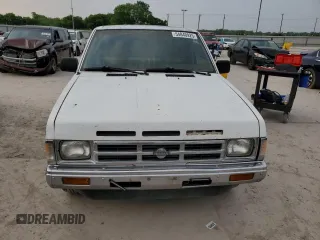 1990 Nissan Frontier z VIN 1N6SD11S8LC377906, wystawiony jako Copart lot #54840925 z przebiegiem 131 024 mil mil oraz Szkody całkowita. Historia ofert i sprzedaży dostępna na DreamBid. Obrazek 5.