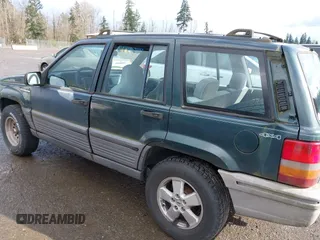 1995 Jeep Grand Cherokee Laredo with VIN 1J4GZ58SXSC676393, listed as a IAAI auction lot 41943464 with 244,317 mi miles. Bid and sale history available at carsss.com. Image 6.