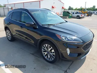 2020 Ford Escape Titanium z VIN 1FMCU9J97LUC22398, wystawiony jako IAAI lot #42457054 z przebiegiem 57 323 mil mil oraz . Historia ofert i sprzedaży dostępna na DreamBid. Obrazek 1.