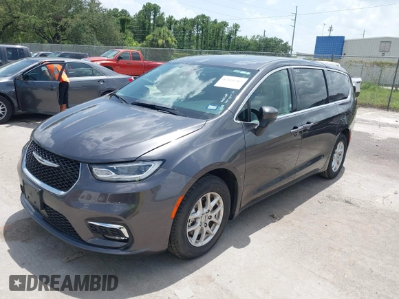 2023 Chrysler Pacifica Touring L with VIN 2C4RC1BG6PR590302, listed as a IAAI auction lot 42451369 with 72,097 mi miles and . Bid and sale history available at DreamBid. Image 2.