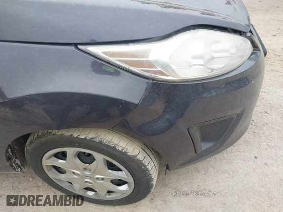 2013 Ford Fiesta S z VIN 3FADP4AJ9DM175576, wystawiony jako IAAI lot #42449969 z przebiegiem 123 959 mil mil oraz . Historia ofert i sprzedaży dostępna na DreamBid. Obrazek 14.