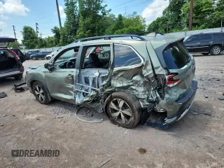 2020 Subaru Forester Touring with VIN JF2SKAXC4LH482519, listed as a Copart auction lot 62868255 with 71,009 mi miles and Salvage title. Bid and sale history available at DreamBid. Image 2.