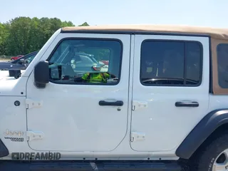 2019 Jeep Wrangler Unlimited Sport S with VIN 1C4HJXDN2KW508341, listed as a IAAI auction lot 42286619 with 49,410 mi miles and . Bid and sale history available at DreamBid. Image 14.