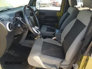 2010 Jeep Wrangler Sahara with VIN 1J4AA5D16AL203910, listed as a Copart auction lot 62891315 with 124,337 mi miles and Salvage title. Bid and sale history available at DreamBid. Image 7.