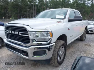 2021 Ram 2500 Big Horn z VIN 3C6UR5DL7MG542617, wystawiony jako IAAI lot #41614844 z przebiegiem 66 869 mil mil oraz . Historia ofert i sprzedaży dostępna na DreamBid. Obrazek 2.