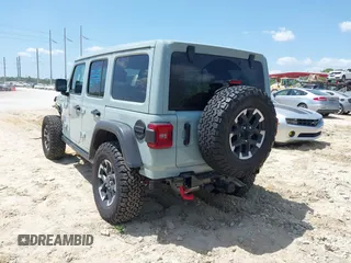 2024 Jeep Wrangler Rubicon with VIN 1C4PJXFG3RW295565, listed as a IAAI auction lot 42026211 with 5,661 mi miles. Bid and sale history available at carsss.com. Image 3.