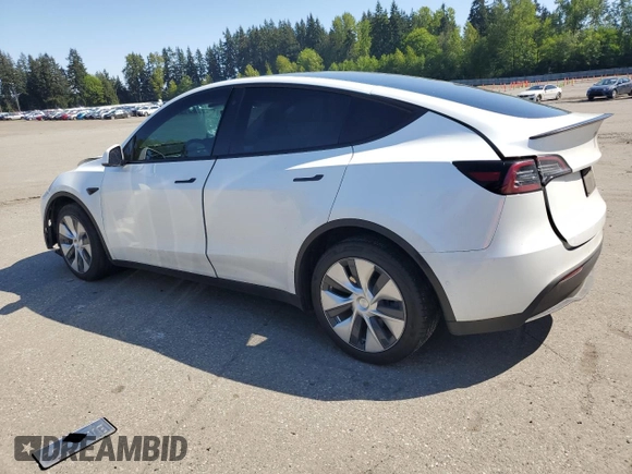2020 Tesla Model Y Long Range with VIN 5YJYGDEF9LF023060, listed as a Copart auction lot 55462395 with 58,211 mi miles and Salvage Title. Bid and sale history available at DreamBid. Image 2.