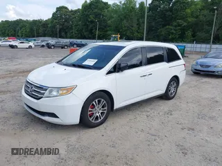 2011 Honda Odyssey EX-L with VIN 5FNRL5H67BB011070, listed as a IAAI auction lot 42491685 with 200,671 mi miles and . Bid and sale history available at DreamBid. Image 2.