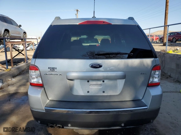 2009 Ford Taurus X SEL with VIN 1FMDK02W69GA04132, listed as a Copart auction lot 77351264 with 87,769 mi miles and Salvage Title. Bid and sale history available at carsss.com. Image 6.