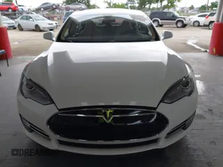2014 Tesla Model S 60 with VIN 5YJSA1S16EFP53350, listed as a IAAI auction lot 42239753 with 104,985 mi miles and . Bid and sale history available at DreamBid. Image 12.