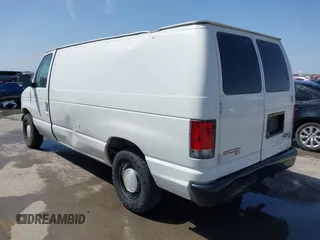 1998 Ford Econoline Cargo with VIN 1FTRE1420WHB15038, listed as a IAAI auction lot 41826051 with 338,809 mi miles. Bid and sale history available at carsss.com. Image 3.