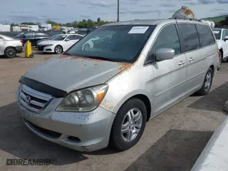 2005 Honda Odyssey EX-L with VIN 5FNRL38745B126338, listed as a IAAI auction lot 41991119 with 165,552 mi miles. Bid and sale history available at carsss.com. Image 2.