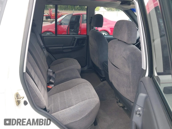 1996 Jeep Grand Cherokee Laredo with VIN 1J4FX58S5TC388512, listed as a IAAI auction lot 42803796 with 147,732 mi miles and . Bid and sale history available at DreamBid. Image 8.