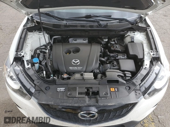 2014 Mazda CX-5 Grand Touring with VIN JM3KE4DY2E0354795, listed as a Copart auction lot 70713544 with 58,848 mi miles and Salvage Title. Bid and sale history available at DreamBid. Image 11.