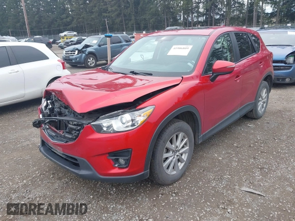 2016 Mazda CX-5 Touring with VIN JM3KE4CY2G0894930, listed as a IAAI auction lot 41906809 with 123,125 mi miles. Bid and sale history available at carsss.com. Image 17.