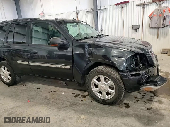 2004 GMC Envoy SLT with VIN 1GKDT13S842421586, listed as a Copart auction lot 51936515 with 188,977 mi miles and Salvage title. Bid and sale history available at DreamBid. Image 14.