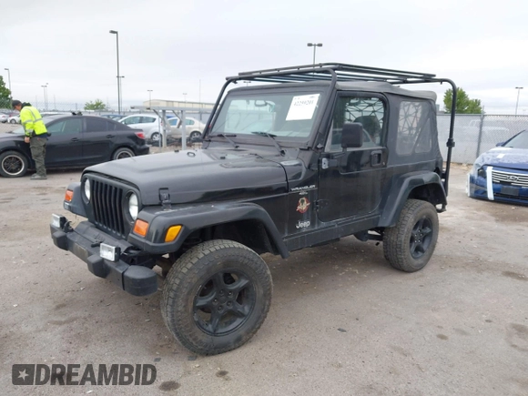 2000 Jeep Wrangler Sahara with VIN 1J4FA59S7YP805628, listed as a IAAI auction lot 42259201 with Not provided miles and . Bid and sale history available at DreamBid. Image 2.