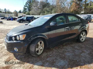 2012 Chevrolet Sonic LTZ z VIN 1G1JE5SH9C4132864, wystawiony jako Copart lot #82810084 z przebiegiem 125 633 mil mil oraz Czysty tytuł • Clean title. Historia ofert i sprzedaży dostępna na DreamBid. Obrazek 1.