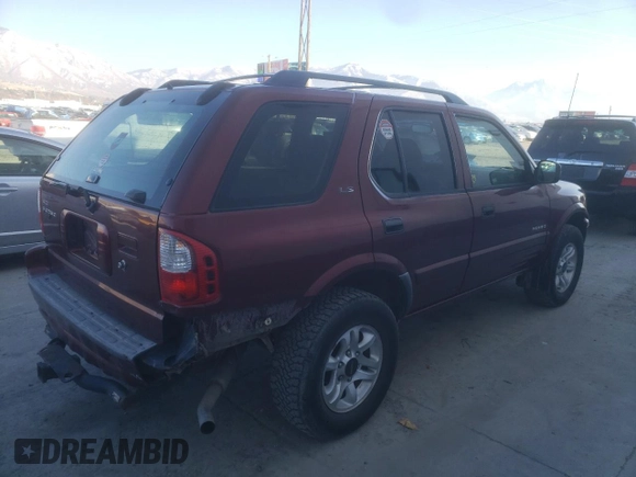 2002 Isuzu Rodeo S with VIN 4S2DM58W824313096, listed as a Copart auction lot 77951364 with 127,470 mi miles and Salvage Title. Bid and sale history available at DreamBid. Image 3.