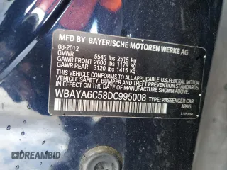 2013 BMW 7 Series 740i with VIN WBAYA6C58DC995008, listed as a Copart auction lot 62008795 with 95,974 mi miles and Salvage title. Bid and sale history available at DreamBid. Image 12.