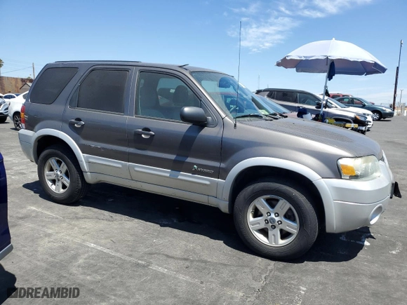 2005 Ford Escape Hybrid with VIN 1FMCU95H35KC95221, listed as a Copart auction lot 67789924 with 169,260 mi miles and Clean Title. Bid and sale history available at carsss.com. Image 4.