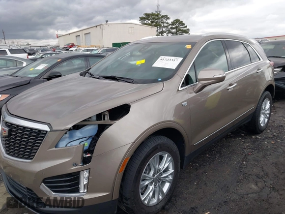 2023 Cadillac XT5 FWD Luxury z VIN 1GYKNAR45PZ140440, wystawiony jako IAAI lot #41723317 z przebiegiem 25 124 mil mil oraz . Historia ofert i sprzedaży dostępna na DreamBid. Obrazek 17.