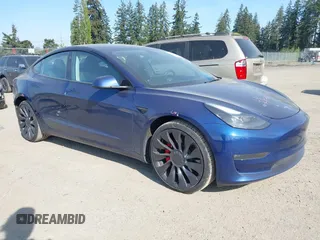 2023 Tesla Model 3 Performance with VIN 5YJ3E1EC2PF679613, listed as a IAAI auction lot 42099199 with 21,721 mi miles. Bid and sale history available at carsss.com. Image 1.