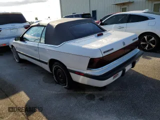 1990 Chrysler LeBaron z VIN 1C3XJ4533LG472070, wystawiony jako Copart lot #74314104 z przebiegiem 97 354 mil mil oraz Szkody całkowita. Historia ofert i sprzedaży dostępna na DreamBid. Obrazek 2.
