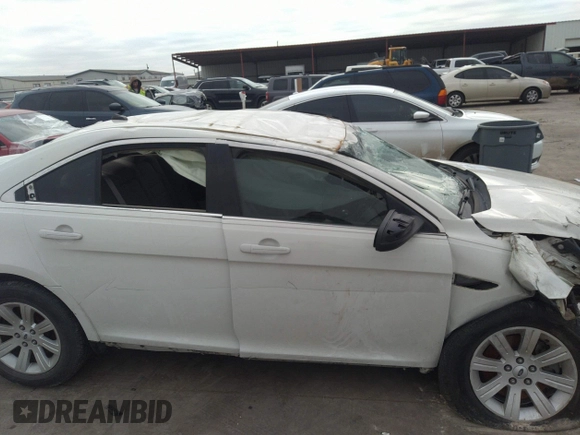 2011 Ford Taurus SE with VIN 1FAHP2DW3BG113398, listed as a IAAI auction lot 41617959 with 123,706 mi miles. Bid and sale history available at carsss.com. Image 12.