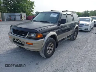 1999 Mitsubishi Montero Sport LS with VIN JA4MT31HXXP024168, listed as a IAAI auction lot 42064951 with 123,539 mi miles. Bid and sale history available at carsss.com. Image 2.