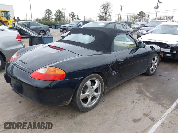 2002 Porsche Boxster z VIN WP0CA298X2U623474, wystawiony jako IAAI lot #41754154 z przebiegiem 98 896 mil mil oraz . Historia ofert i sprzedaży dostępna na DreamBid. Obrazek 4.