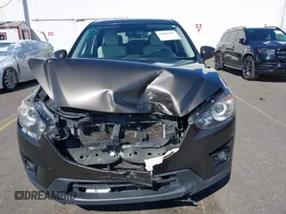 2016 Mazda CX-5 Grand Touring with VIN JM3KE2DYXG0773663, listed as a IAAI auction lot 41896367 with 86,571 mi miles and . Bid and sale history available at DreamBid. Image 6.