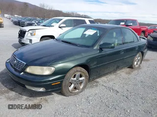 2000 Cadillac Catera z VIN W06VR54R0YR002664, wystawiony jako IAAI lot #41857553 z przebiegiem 86 354 mil mil oraz . Historia ofert i sprzedaży dostępna na DreamBid. Obrazek 6.
