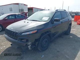 2015 Jeep Cherokee North with VIN 1C4PJMCS7FW544792, listed as a IAAI auction lot 41801573 with 140,575 mi miles. Bid and sale history available at carsss.com. Image 18.