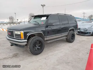 1999 Chevrolet Tahoe Z71 with VIN 1GNEK13RXXJ448516, listed as a IAAI auction lot 41809885 with 254,307 mi miles. Bid and sale history available at carsss.com. Image 2.