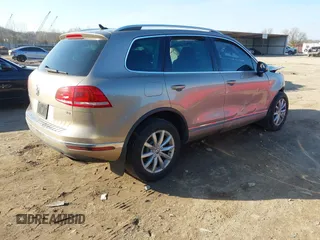 2016 Volkswagen Touareg Sport with VIN WVGEF9BP0GD003241, listed as a IAAI auction lot 41498797 with 90,141 mi miles and . Bid and sale history available at DreamBid. Image 4.