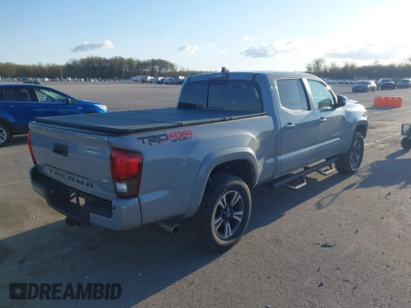 2018 Toyota Tacoma SR5 with VIN 3TMDZ5BN3JM054548, listed as a IAAI auction lot 42038480 with 122,242 mi miles and . Bid and sale history available at DreamBid. Image 4.