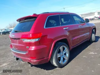 2014 Jeep Grand Cherokee Overland with VIN 1C4RJFCG2EC216406, listed as a IAAI auction lot 41944794 with 124,007 mi miles. Bid and sale history available at carsss.com. Image 4.